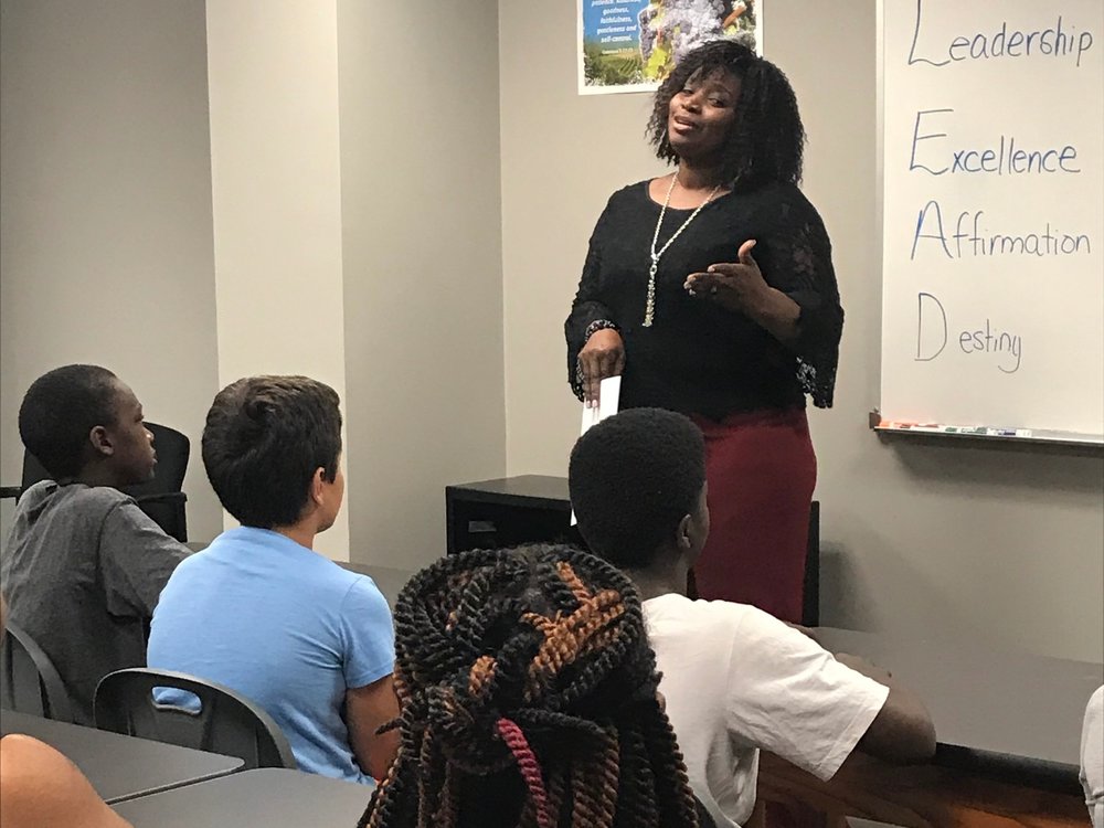 Purpose Academy teacher teaching students.